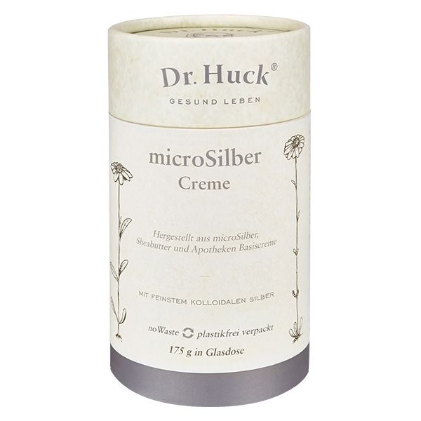 Emballage cylindrique avec inscription Dr. Huck microSilber Creme. Illustrations florales et couvercle argenté.