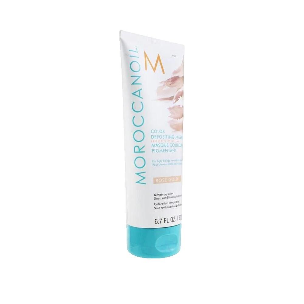 Tube blanche avec bouchon turquoise. Inscription: Moroccanoil, Masque Couleur Pigmentant, Rose Gold. Contenu: 200 ml.