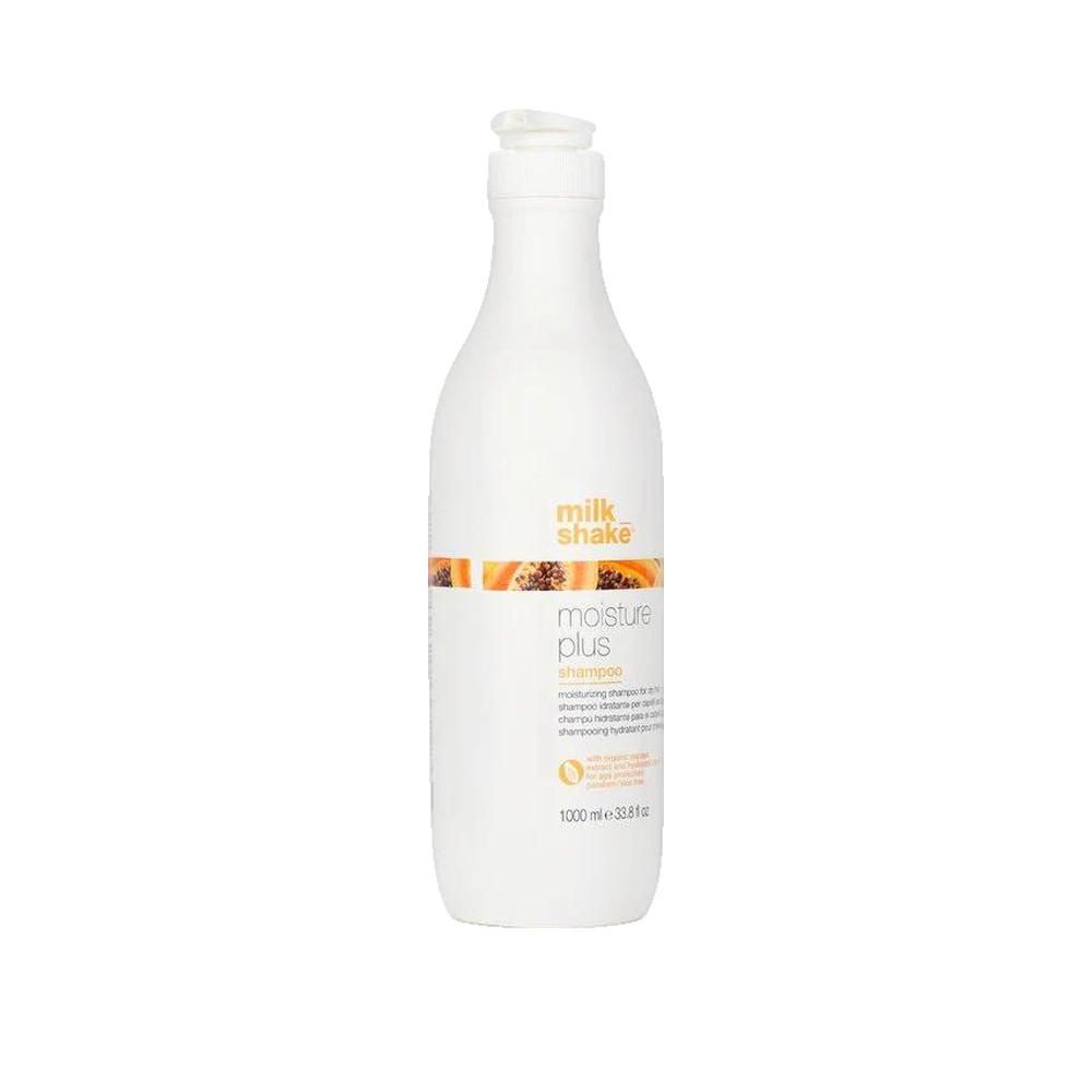 Flacon blanc avec pompe. Inscription: milk_shake, moisture plus shampoo. Bande orange avec illustration de papaye. 1000 ml.