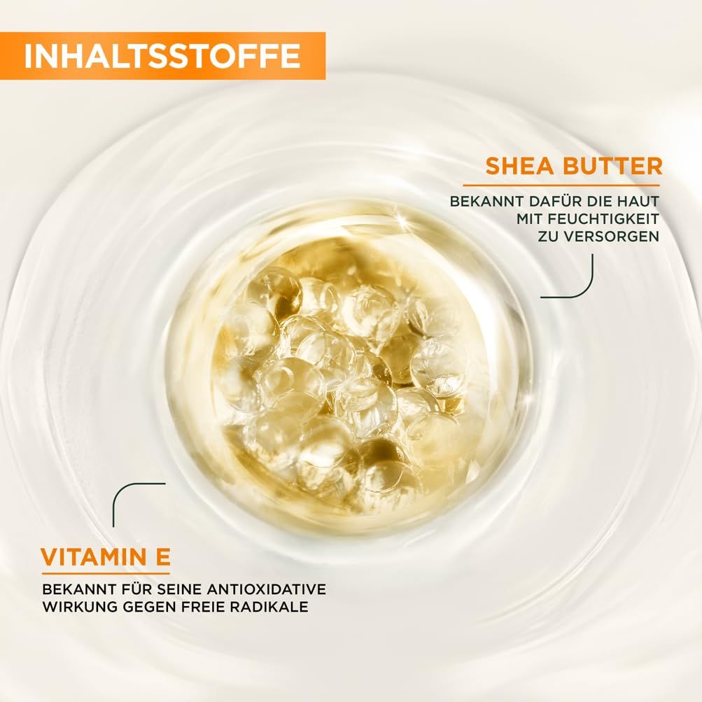 Gros plan sur les ingrédients. Beurre de karité et vitamine E dans un liquide. Texte: Beurre de karité, connu pour l'hydratation. Vitamine E, antioxydant.