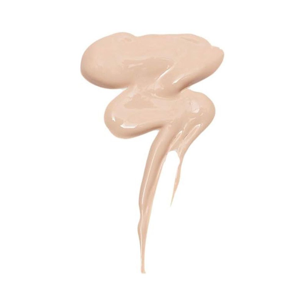 Échantillon de correcteur clair, crémeux, sur fond blanc. Texture brillante, forme ondulée.