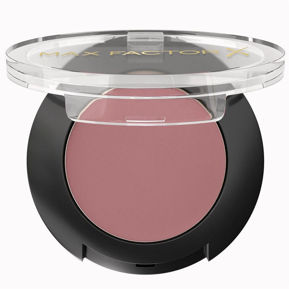 Ronde zwarte oogschaduwcontainer met transparant deksel. De oogschaduw is roze. Het deksel draagt de merknaam.