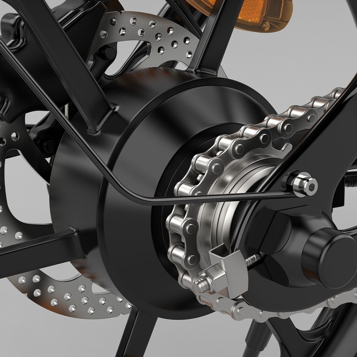 Gros plan sur la roue arrière d'un vélo électrique. Chaîne, disque de frein et pignon.