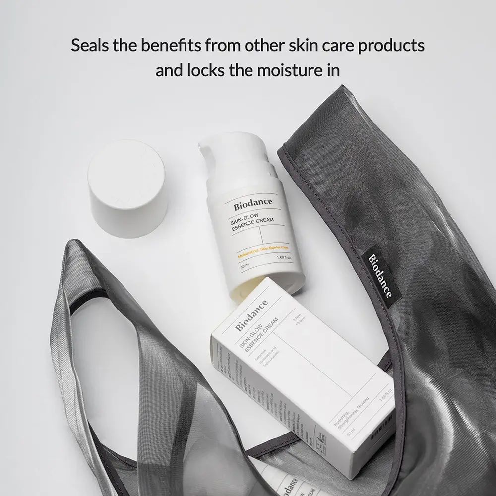 Sac avec flacon et boîte "Biodance Skin-Glow Essence Cream". Contient également un couvercle.