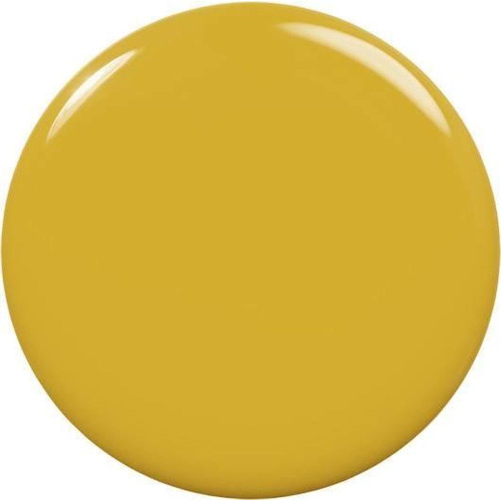 Tache de vernis à ongles jaune. Forme ronde, surface brillante.