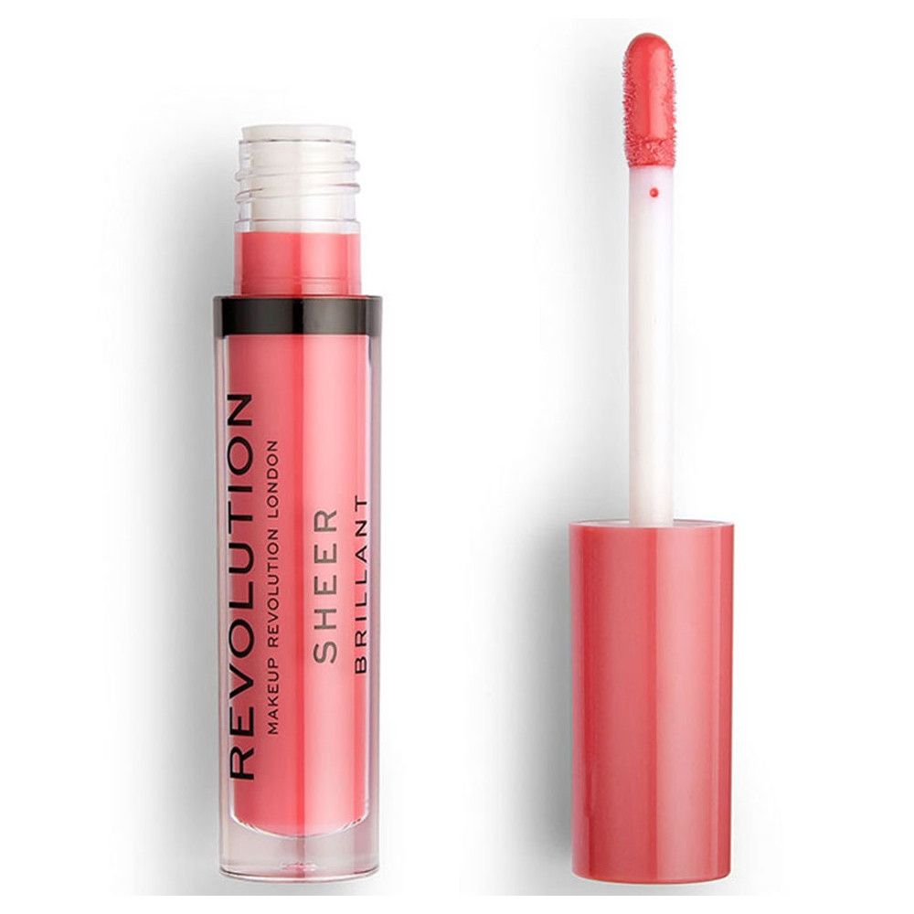 Flacon de gloss avec applicateur. Le gloss est rose. L'applicateur est blanc avec une pointe rose. "REVOLUTION LONDON SHEER BRILLANT" est écrit sur le flacon.