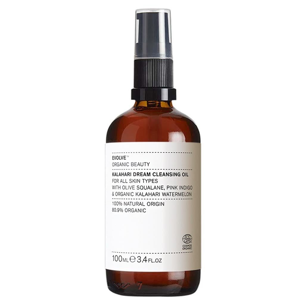Flacon en verre brun avec vaporisateur. Étiquette avec informations produit: Kalahari Dream Cleansing Oil, 100% Natural Origin, 80.9% Organic.