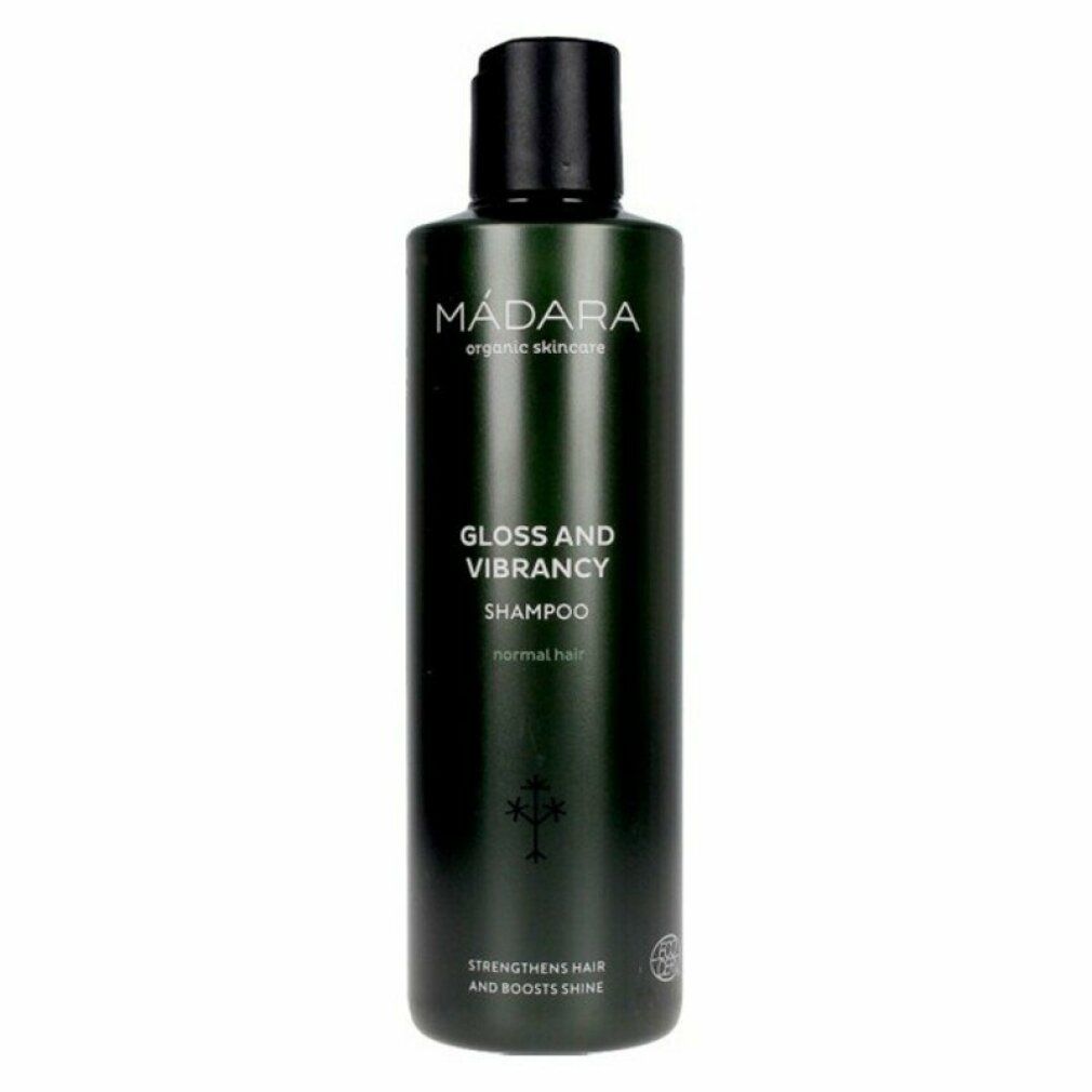 Flacon vert avec bouchon noir. Inscription: MÁDARA organic skincare, Gloss and Vibrancy Shampoo, renforce les cheveux et apporte de la brillance.