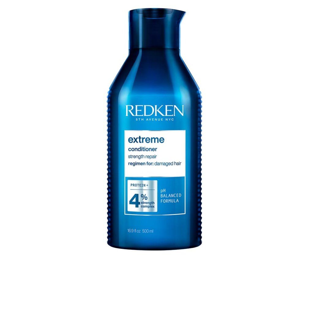 Blauwe Redken Extreme Conditioner. Fles met wit etiket. Tekst: Extreme, strength repair, pH Balanced Formula, 500ml.