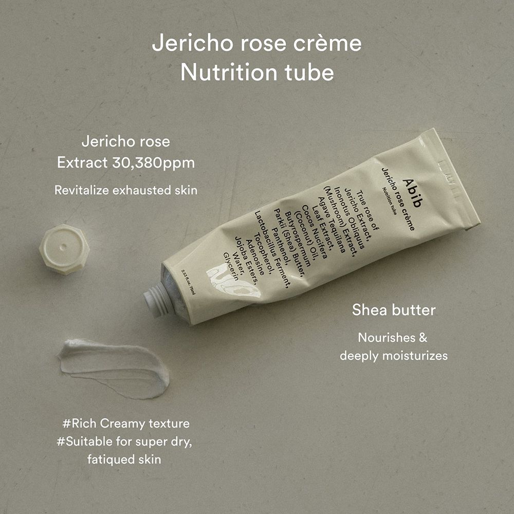 Tube de crème ouvert. Abib Jericho Rose Crème. Filet de crème à côté. Texte: Jericho Rose Extract, Shea Butter.