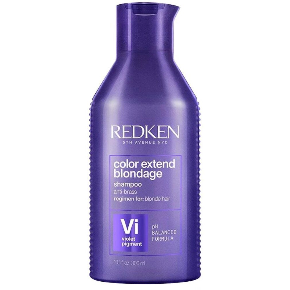 Flacon violet de shampooing Redken Color Extend Blondage. Produit couché. Pigments violets s'écoulent. Texte : Shampooing, pH équilibré.