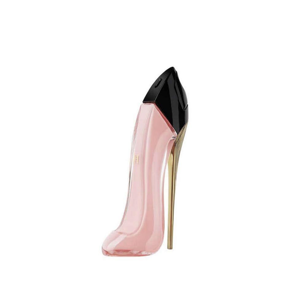 Roze high heel fles. Zwarte dop. Goudkleurige hak. Parfumfles.