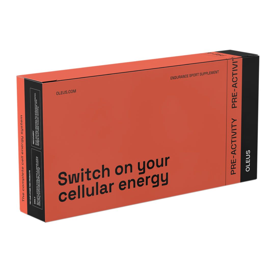 Rechthoekige verpakking, oranje en zwart met witte tekst. Opschrift: OLEUS PRE-ACTIVITY. Tekst: Switch on your cellular energy.
