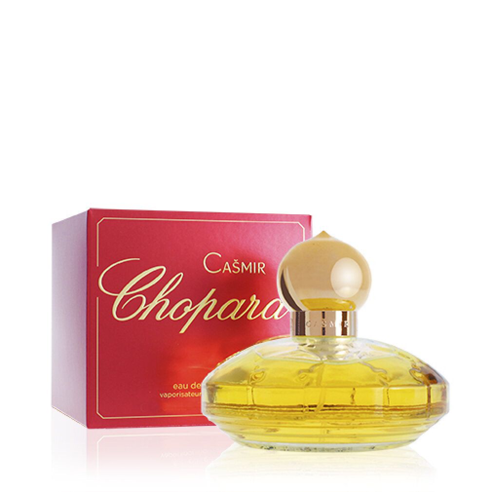 Geel parfumflesje met gouden dop en rode verpakking. Opschrift: Casmir Chopard.