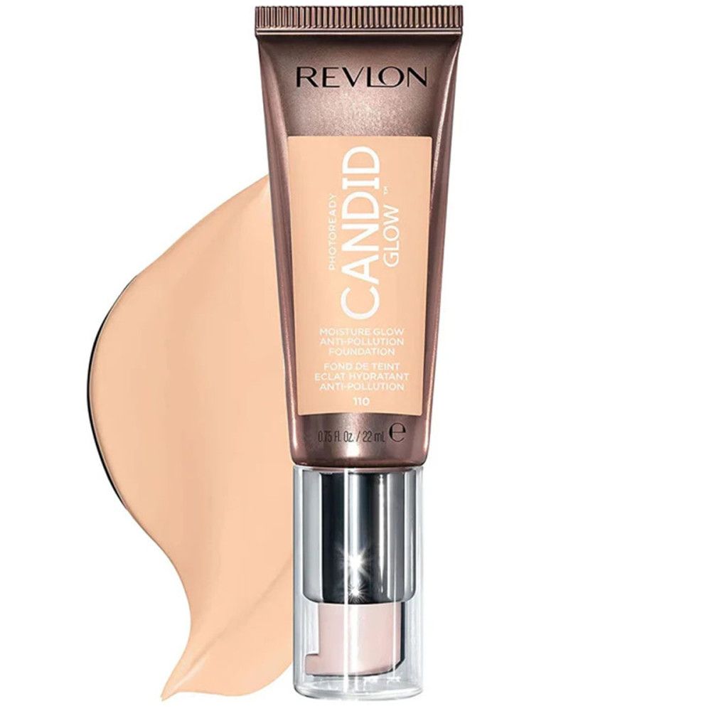 Revlon PhotoReady Candid Glow Foundation. Beige tube met product en kleurvlek. Tekst: CANDID GLOW, Anti-vervuiling.