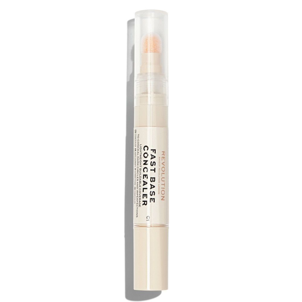 Bâton de correcteur avec applicateur éponge. Inscription: Fast Base Concealer.