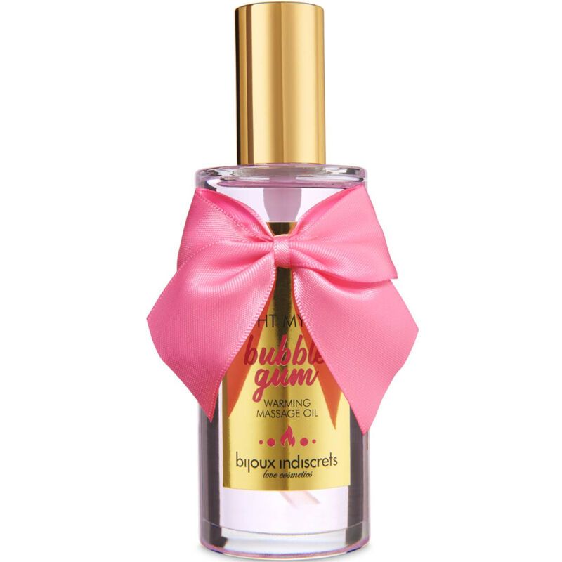 Massageolie in glazen fles met gouden dop en roze strik. Etiket met "Bubble Gum" en "Warming Massage Oil".