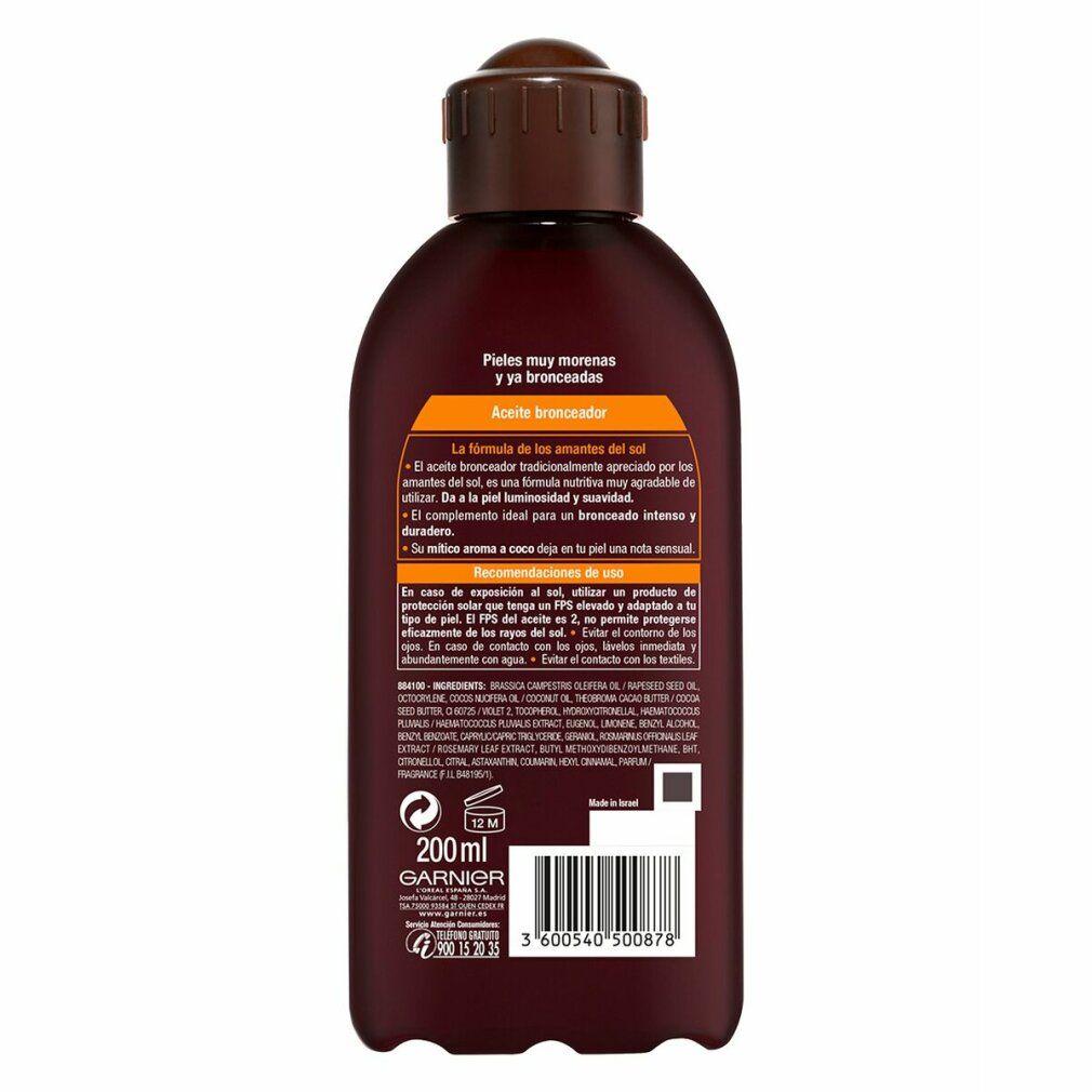 Arrière d'une bouteille d'huile bronzante Garnier Delial Ambre Solaire Ideal Bronze avec informations produit et indication 200ml.