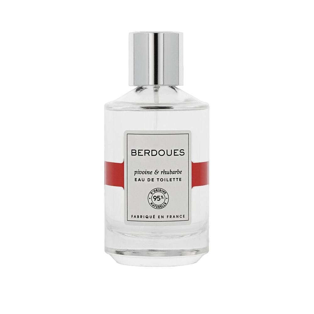 Glazen fles met zilveren dop. Opschrift: BERDOUES, pivoine & rhubarbe, Eau de Toilette. 95% naturelle. Gemaakt in Frankrijk.