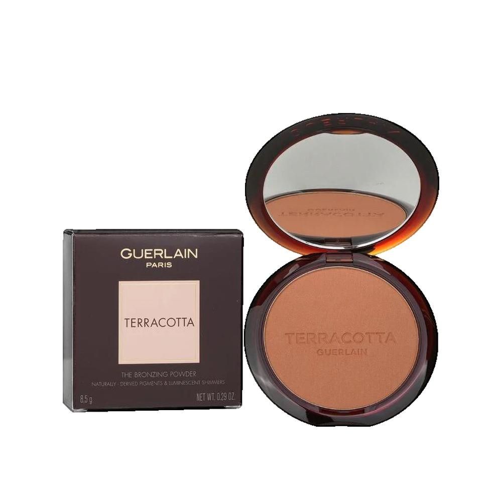Poudre bronzante compacte avec miroir et emballage. Inscription "TERRACOTTA" et "GUERLAIN".