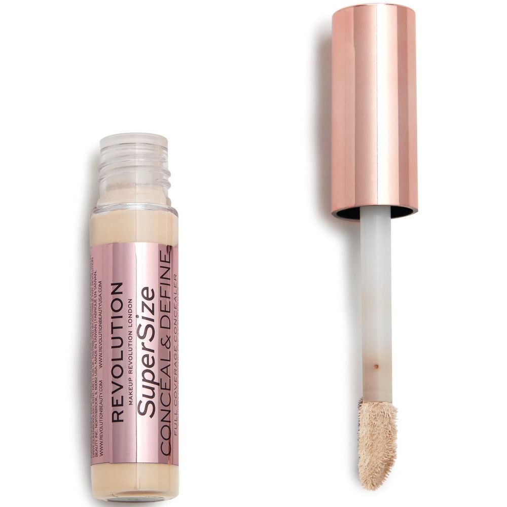 Flacon de correcteur avec bouchon or rose et applicateur. Nom du produit visible.