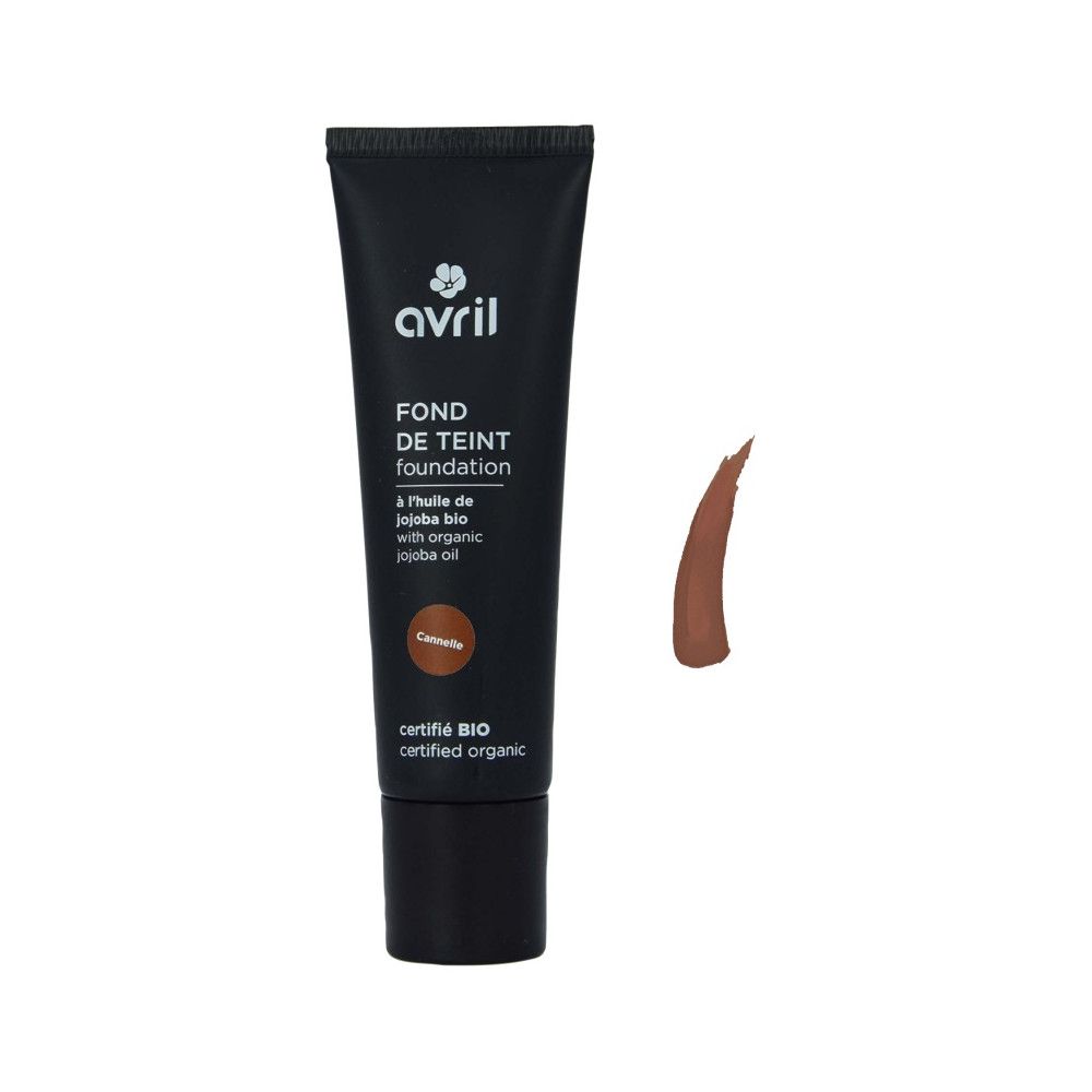Tube de fond de teint, marron. Inscription: Avril, Fond de Teint, à l'huile de jojoba bio, Cannelle. Certification bio.