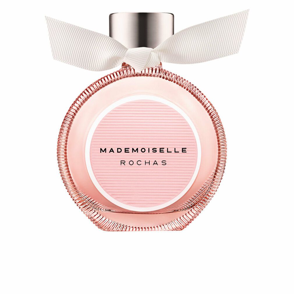 Rochas Mademoiselle Eau de Parfum. Rond roze glazen flesje met wit lint. Opschrift: Mademoiselle Rochas.