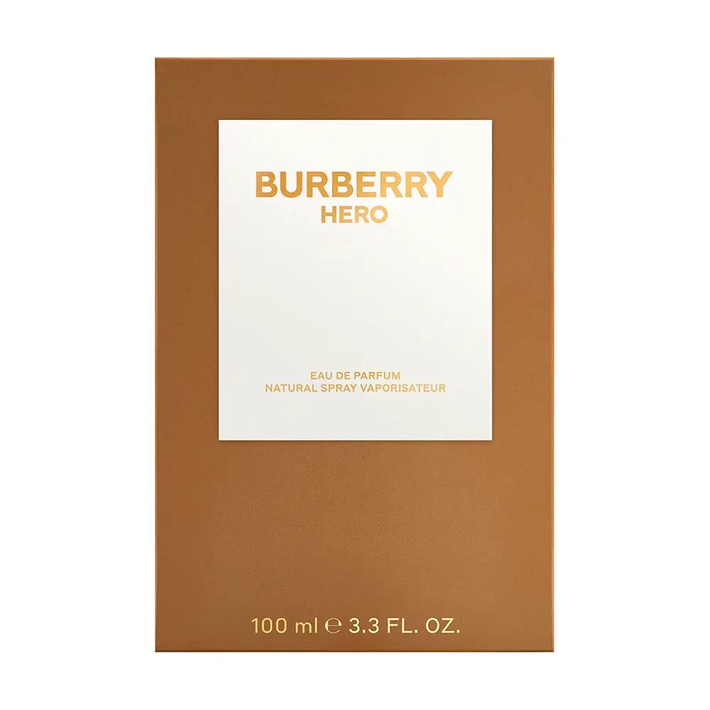 Bruine verpakking met wit kader en gouden tekst. Tekst: BURBERRY HERO, Eau de Parfum, 100 ml.