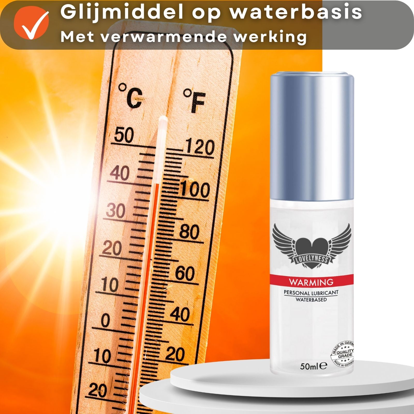 Glijmiddel fles naast thermometer. Tekst: "Glijmiddel op waterbasis", "Met verwarmende werking".